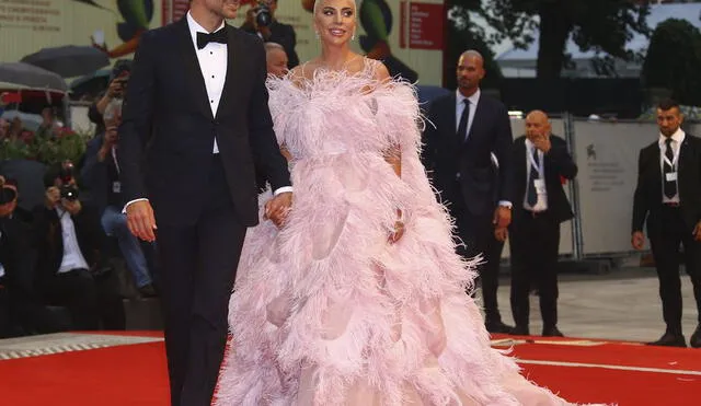 Actress and singer Lady Gaga, right, and actor Bradley Cooper pose for photographers upon arrival at the premiere of the film 'A Star Is Born' at the 75th edition of the Venice Film Festival in Venice, Italy, Friday, Aug. 31, 2018. (Photo by Joel C Ryan/Invision/AP)