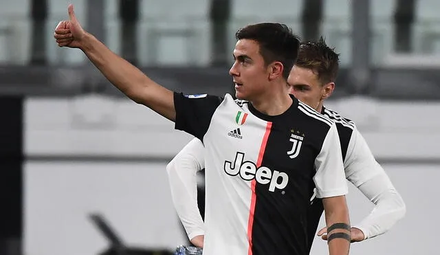 Juventus' Argentine forward Paulo Dybala celebrates after scoring their second goal during the Italian Serie A football match Juventus vs Inter Milan, at the Juventus stadium in Turin on March 8, 2020. - The match is played behind closed doors due to the novel coronavirus outbreak. (Photo by Vincenzo PINTO / AFP)