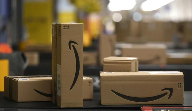 This picture shows packed goods on a conveyor belt at the distribution center of US online retail giant Amazon in Moenchengladbach, on December 17, 2019. (Photo by INA FASSBENDER / AFP)