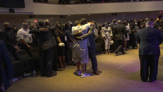 MINNEAPOLIS, MN - JUNE 04: Attendees of a memorial for George Floyd embrace after the service at North Central University on June 4, 2020 in Minneapolis, Minnesota. Memorial services will also be held in North Carolina and Texas.   Stephen Maturen/Getty Images/AFP