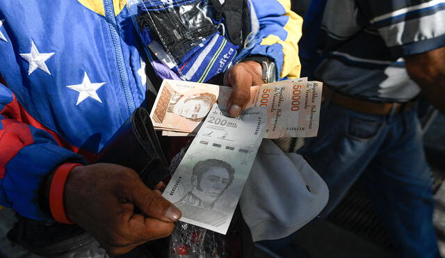 En Venezuela, los bonos de la Patria son un bálsamo para un sector de la población. Foto: AFP