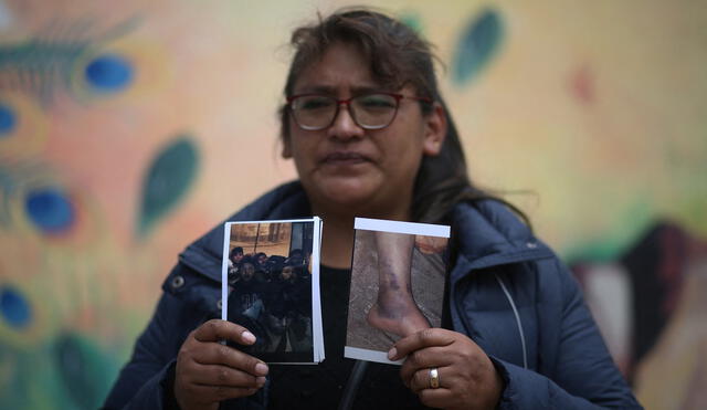 Natividad Maman, 40, shows pictures in El Alto, Bolivia on March 23, 2021, of her son Joga Marconi, 23, who was subdued and allegedly tortured in the Senkata area, during confrontations between supporters and opponents of Bolivian former president Evo Morales on November, 2019, which ended in his resignation. - On November 11, 2019 Bolivia lived in a social convulsion after the resignation of Bolivian former president Evo Morales, when alleged force abuses occurred amid the chaos. A year and a half later, the victims of that nefarious Monday demand justice. (Photo by LUIS GANDARILLAS / AFP)