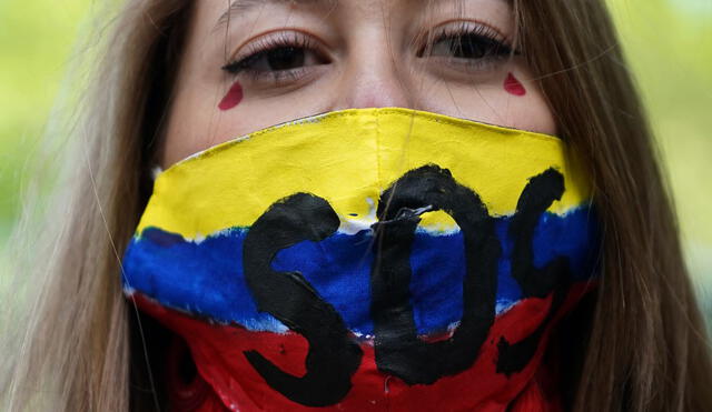 Se han registrado alrededor de 15 casos de violencia de género durante las protestas en Colombia. Foto: AFP/ Timothy A. Clary