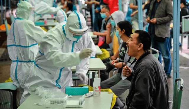 El último sábado, la ciudad china registró 37 infecciones locales de coronavirus. Foto: AFP