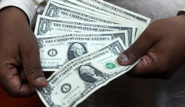 Conoce cuál es el precio del dólar en Perú hoy, miércoles 12 de enero de 2022. Foto: AFP