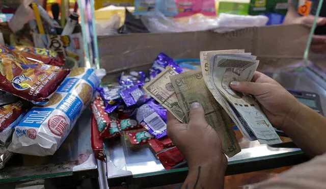 Precio del dólar BCV, uno de los más consultados para diversas transacciones en Venezuela. Foto: AFP