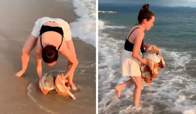 Mientras caminaba por una playa, la mujer detuvo de forma rápida para auxiliar al pez globo que era golpeado por las olas. Foto: composición LR/YouTube/Clarín