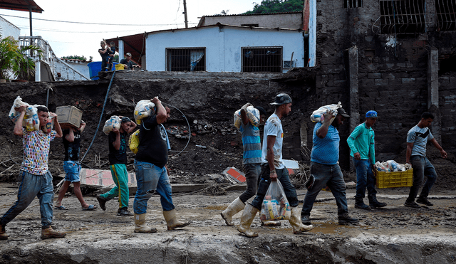 En la localidad de Tejerías continúa la búsqueda de las personas desaparecidas. Foto: AFP