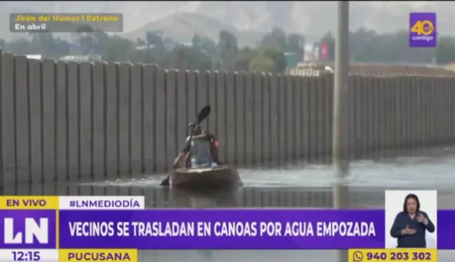 Vecinos de Pucusana se trasladan en canoas por agua empozada a consecuencia de huaicos. Foto: captura de Latina - Video: Latina