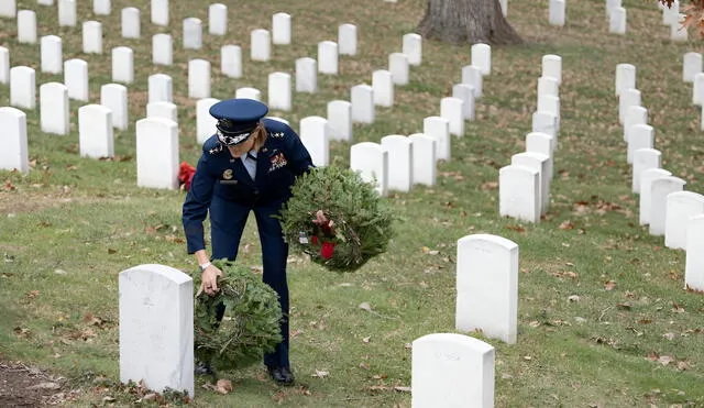 A military officer honors fallen heroes by laying wreaths at Arlington National Cemetery, symbolizing the VA's renewed commitment to serving veterans with dignity and respect. Photo: Elizabeth Fraser/Army A military officer honors fallen heroes by laying wreaths at Arlington National Cemetery, symbolizing the VA's renewed commitment to serving veterans with dignity and respect. Photo: Elizabeth Fraser/Army
