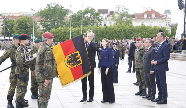 German Chancellor Friedrich Merz, with his dellegation, attend the line-up roll call ceremony for 45th Armoured Brigade in Lithuania. Photo: AFP News