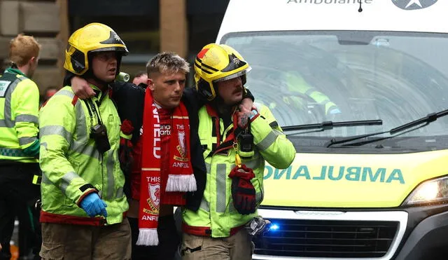 Crowd at Liverpool parade reacts in shock as emergency services respond to the car crash that injured 79 people. Photo: Action Images Crowd at Liverpool parade reacts in shock as emergency services respond to the car crash that injured 79 people. Photo: Action Images