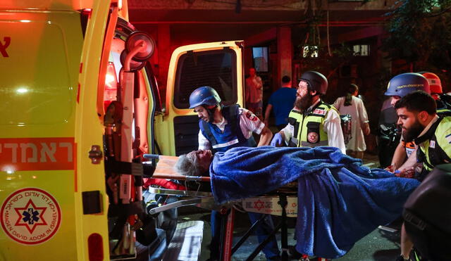 Israeli emergency teams respond after Iranian missile strikes leave one dead and over 50 injured across multiple cities. Photo: AFP Israeli emergency teams respond after Iranian missile strikes leave one dead and over 50 injured across multiple cities. Photo: AFP
