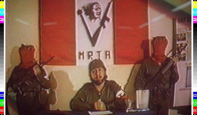 In this photo taken in February 1996 from a Peruvian television broadcast, the leader of the Tupac Amaru Revolutionary Movement (MRTA) Nestor Cerpa Cartolini(C) talks about their plan to attack the Peruvian Congress in December 1995. The attack was thwarted by authorities, and Cerpa Cartolini is one of the rebels who stormed the Japanese Ambassador's residence in Lima 17 December, where they continue to hold some 300 hostages. (Photo by PERUVIAN TELEVISION / HO / AFP)
