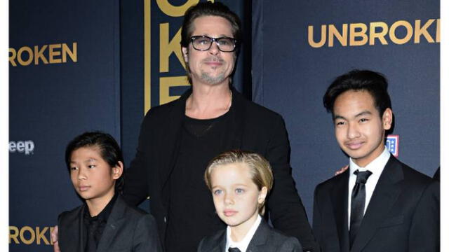 Brad Pitt, en 2014, con Shiloh, Pax y Maddox. Foto: afp   