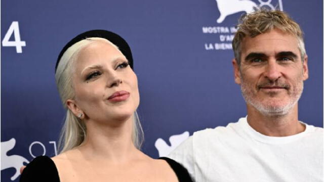 Phoenix con Lady Gaga durante la promoción de 'Joker'. Foto: AFP   