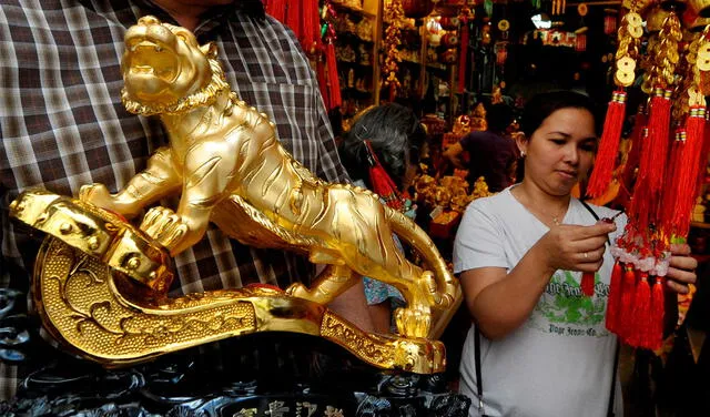 De preferencia, se recomienda que la figura del tigre sea de color amarillo, que simboliza dinero. Foto: AFP