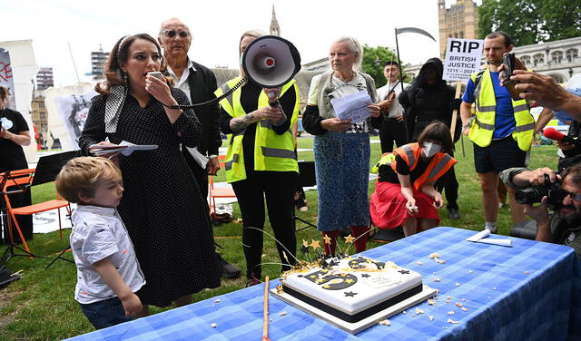 Julian Assange supporters celebrate Assange's 50th birhtday at Parliament Square in London