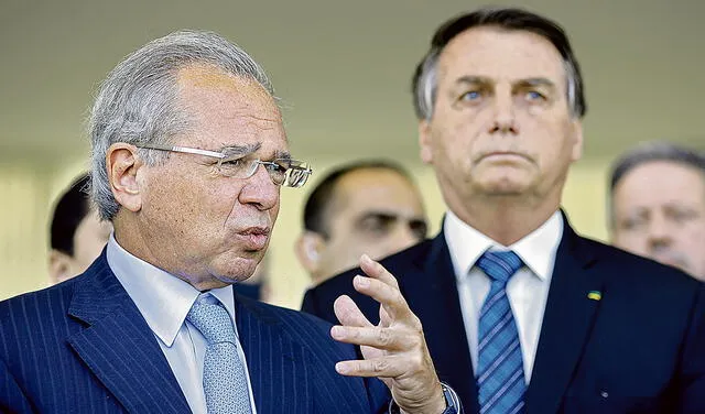 En la mira. Paulo Guedes con el presidente Bolsonaro. Foto: AFP