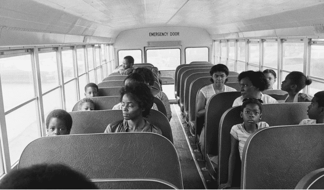 People of color gathered on the same school bus a few decades ago. Photo: Axios People of color gathered on the same school bus a few decades ago. Photo: Axios