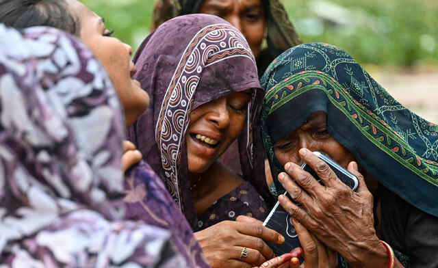 Relatives of Akash Patni, a 14 year old boy who was sleeping on the ground when the Air India Flight 171 crashed in a residential area were mourning the death of him. Photo: AFP News Relatives of Akash Patni, a 14 year old boy who was sleeping on the ground when the Air India Flight 171 crashed in a residential area were mourning the death of him. Photo: AFP News