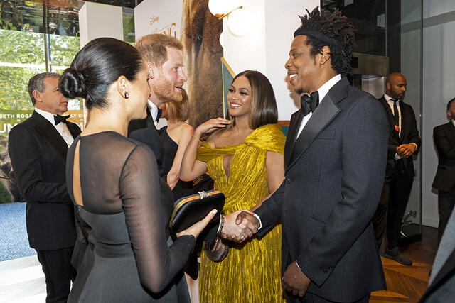 Britain's Prince Harry, Duke of Sussex (3rd L) and Britain's Meghan, Duchess of Sussex (2nd L) meet cast and crew, including US singer-songwriter Beyoncé (C) and her husband, US rapper Jay-Z (R) as they attend the European premiere of the film The Lion King in London on July 14, 2019. (Photo by Niklas HALLE'N / POOL / AFP)
